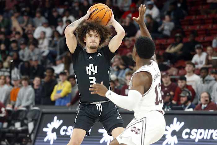 North Alabama Lions guard KJ Johnson (3) passes the ball as Mississippi State Bulldogs guard Josh Hubbard (13) defends during the second half at Humphrey Coliseum.